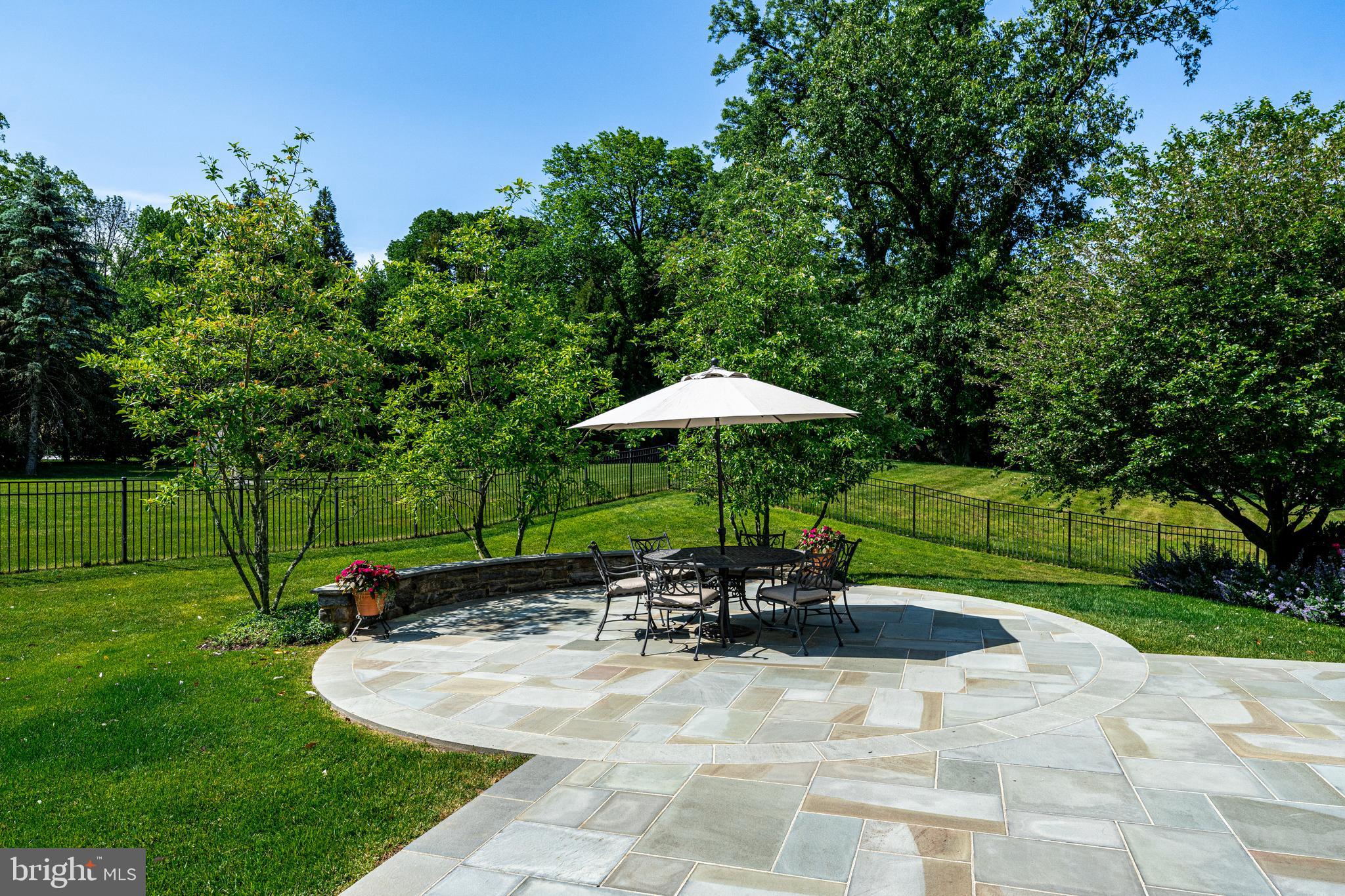 318 Winfield Road Devon, PA 19333 - Photo 32 of 97 a swimming pool with outdoor seating yard and green space
