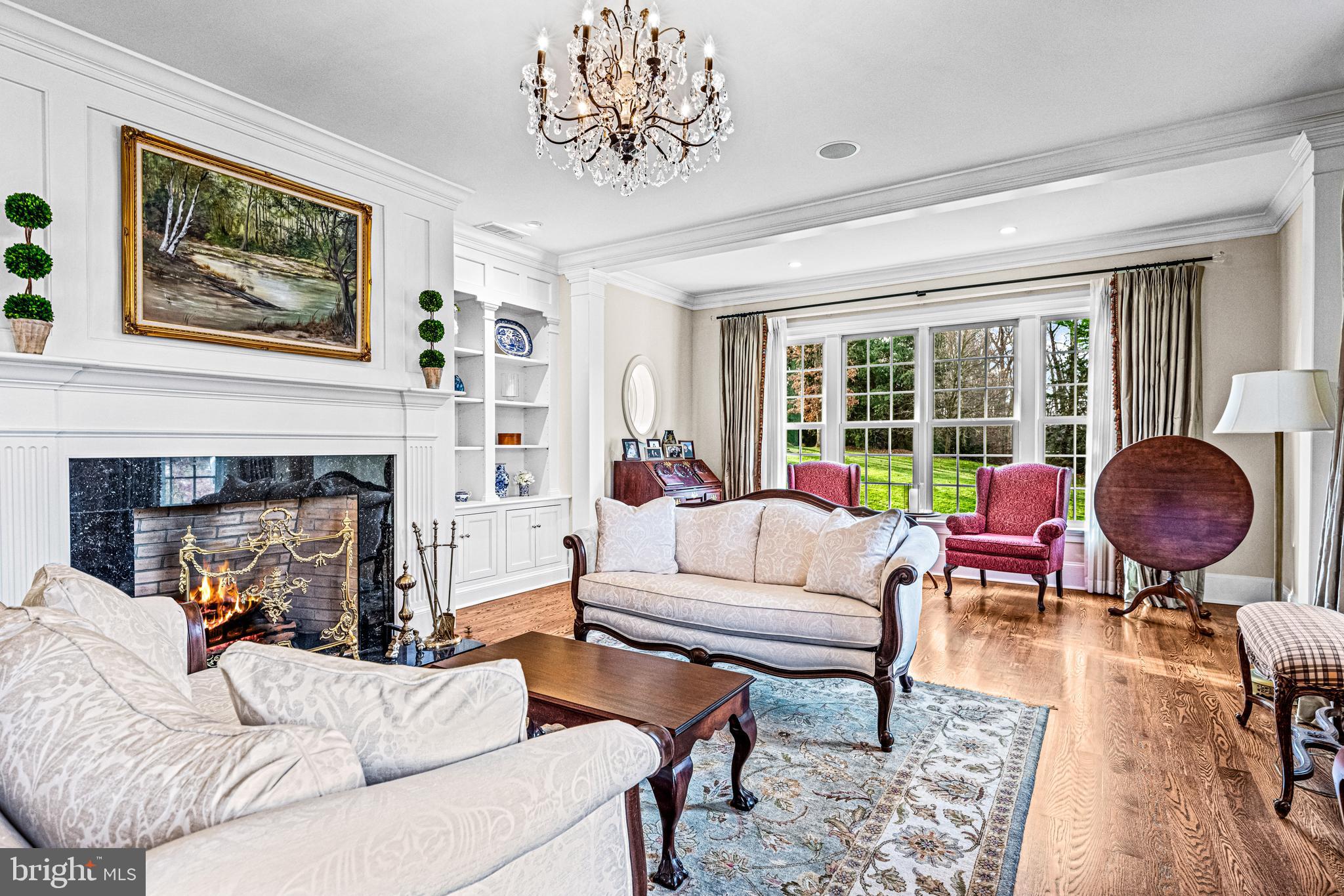 318 Winfield Road Devon, PA 19333 - Photo 39 of 97 a living room with furniture a fireplace and a large window