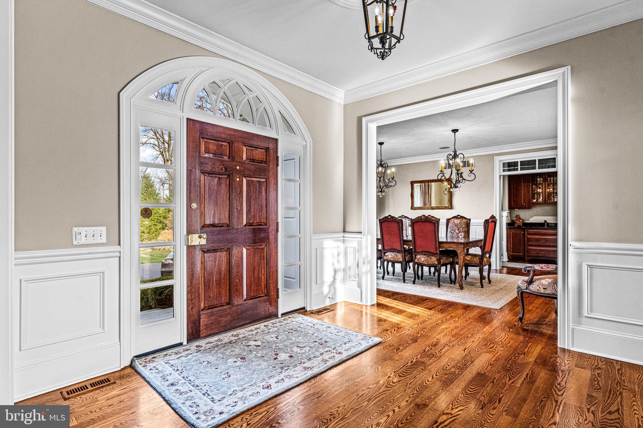 318 Winfield Road Devon, PA 19333 - Photo 42 of 97 a view of a livingroom dining room and hall with wooden floor