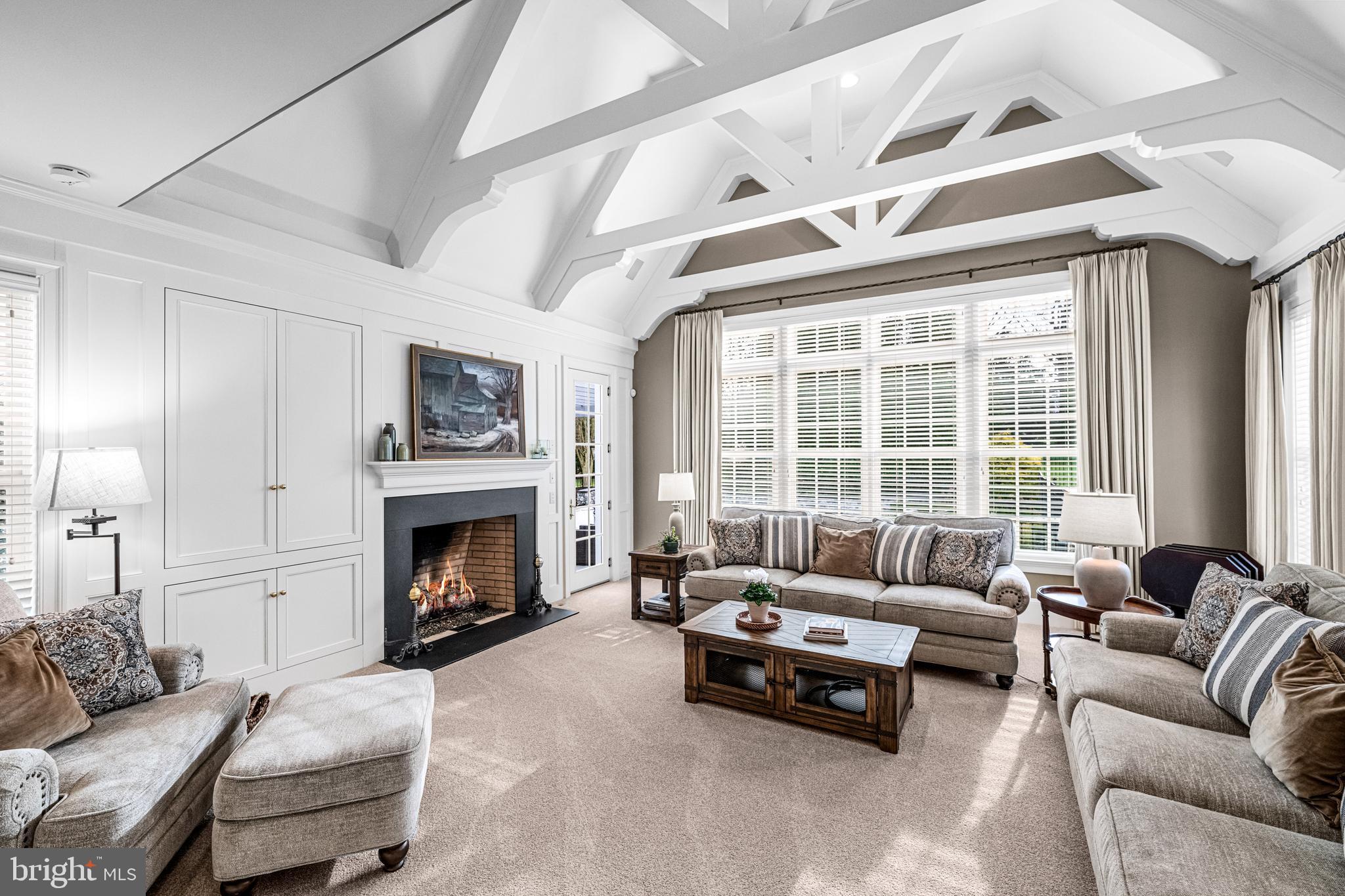 318 Winfield Road Devon, PA 19333 - Photo 52 of 97 a living room with furniture and a fireplace