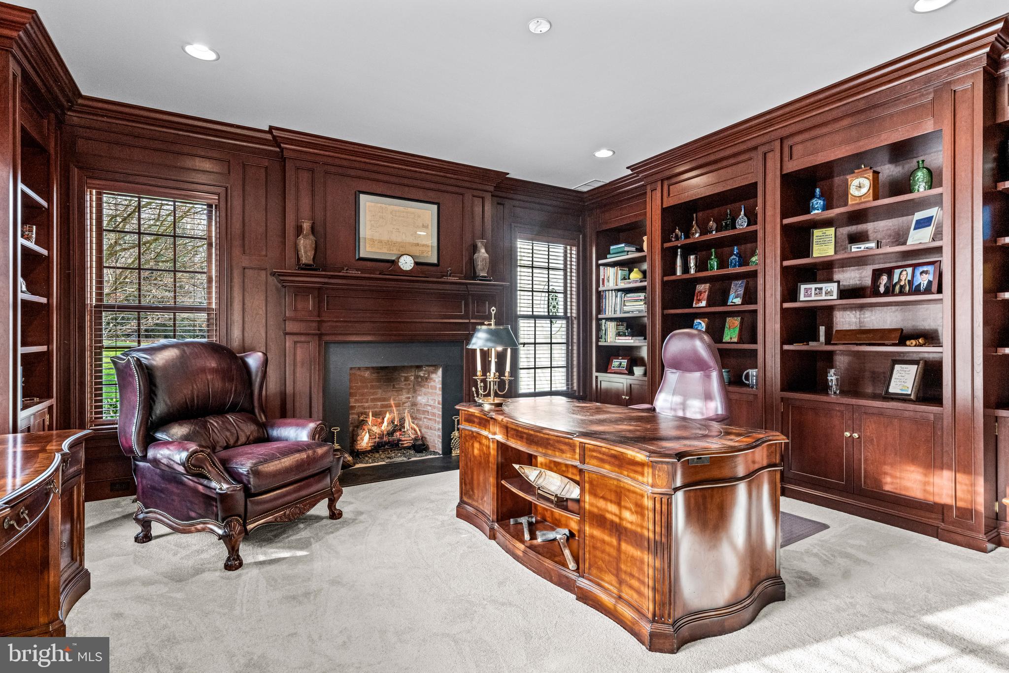 318 Winfield Road Devon, PA 19333 - Photo 56 of 97 a living room with furniture a fireplace and a book shelf