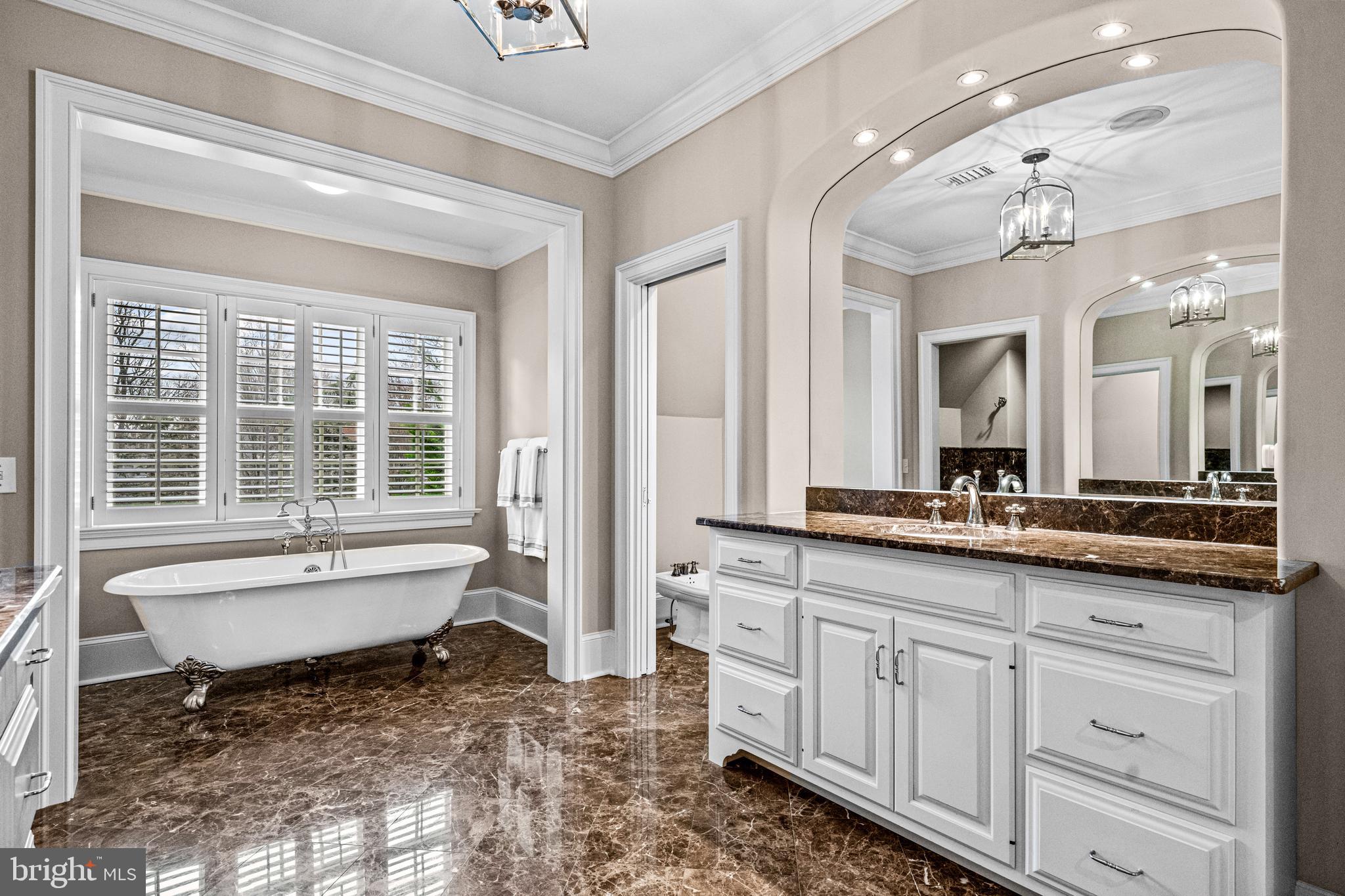 318 Winfield Road Devon, PA 19333 - Photo 69 of 97 a spacious bathroom with a granite countertop sink and a mirror
