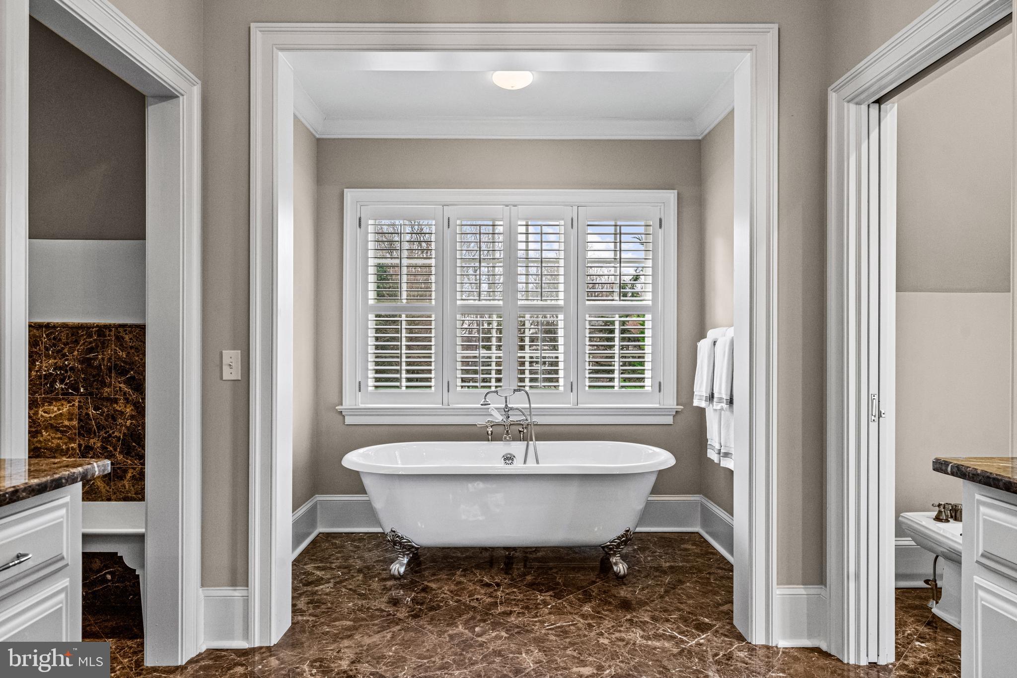 318 Winfield Road Devon, PA 19333 - Photo 71 of 97 a view of a bathroom with a tub and sink