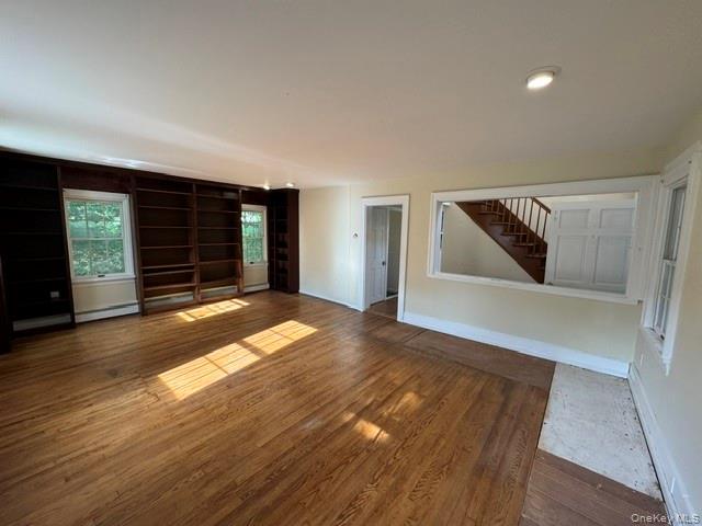 74 South Airmont Road Suffern, NY 10901 - Photo 9 of 42 Spacious room featuring wood-finish flooring, recessed lighting, and built-in shelving