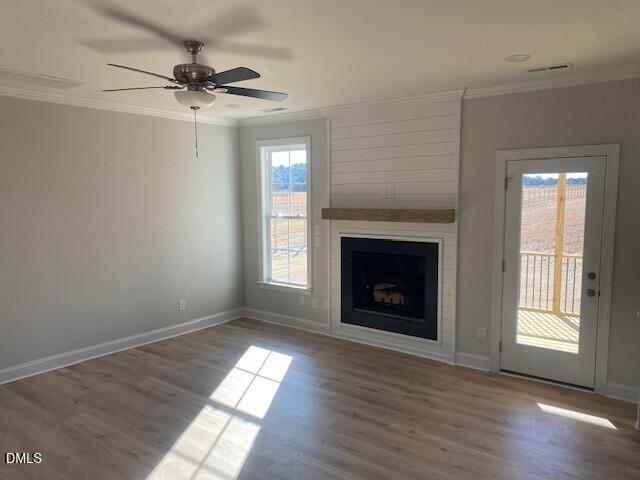 5495 Finch Road Bailey, NC 27880 - Photo 14 of 32 a view of an empty room with exposed radiator and fireplace