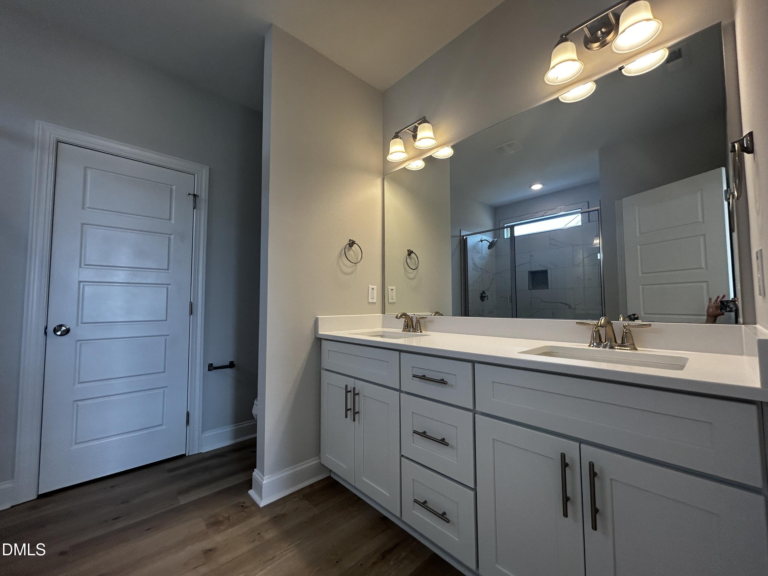 5495 Finch Road Bailey, NC 27880 - Photo 17 of 32 a bathroom with double vanity sinks and a mirror