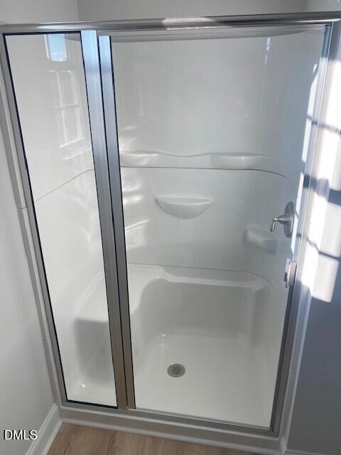 5495 Finch Road Bailey, NC 27880 - Photo 29 of 32 a bathroom with a glass door shower and toilet