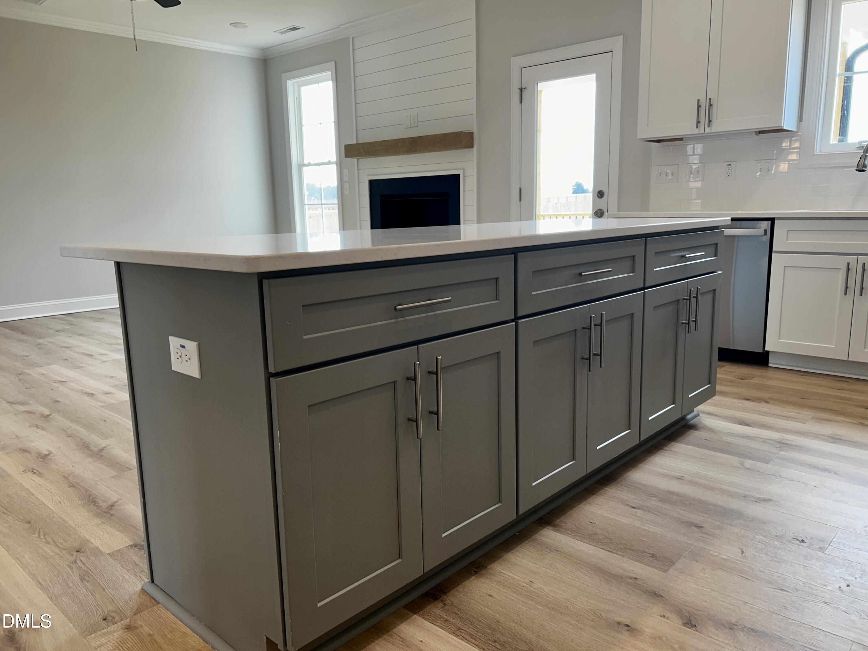 5495 Finch Road Bailey, NC 27880 - Photo 6 of 32 a kitchen with cabinets and white appliances