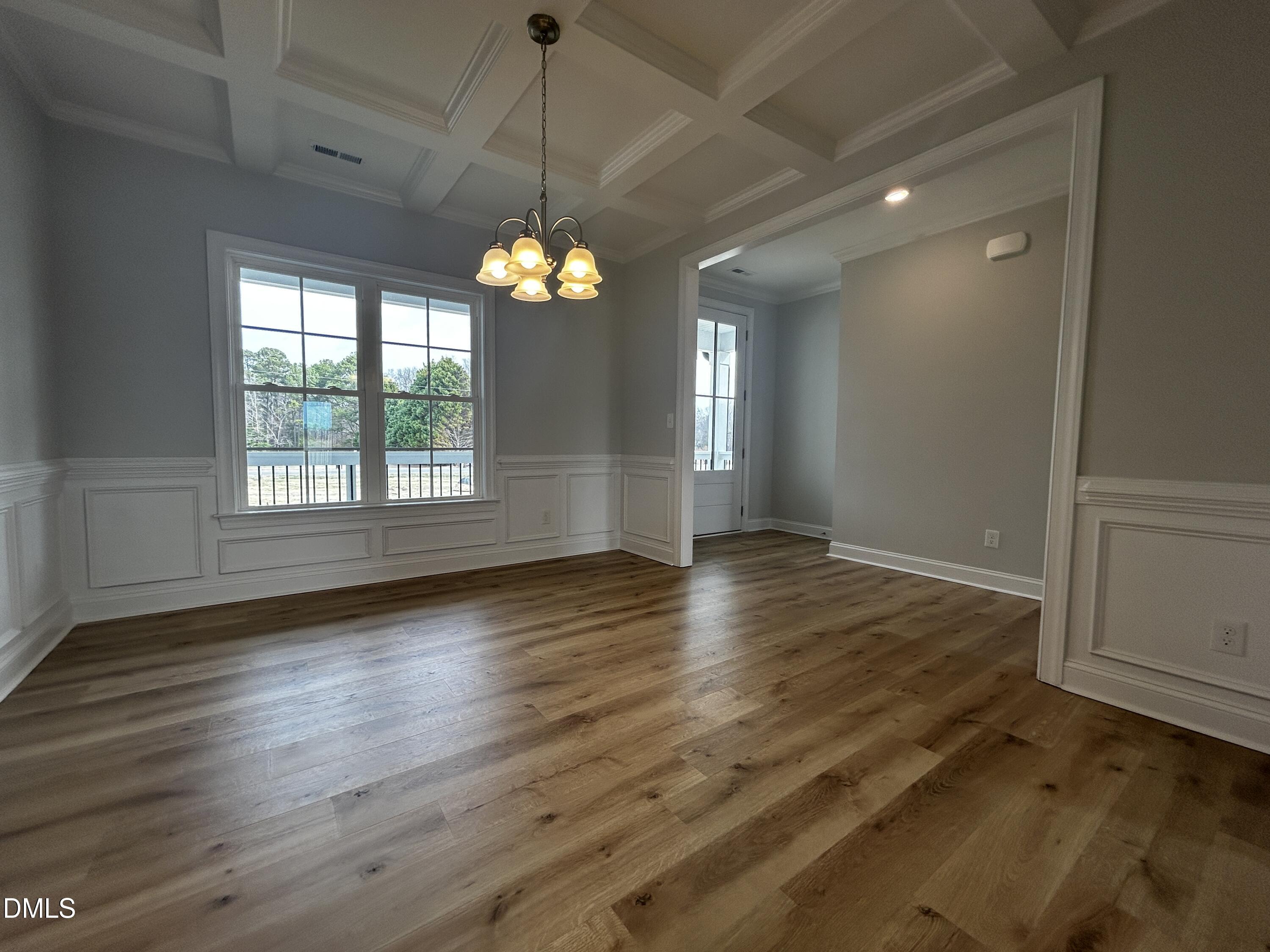 5495 Finch Road Bailey, NC 27880 - Photo 8 of 32 an empty room with wooden floor and windows