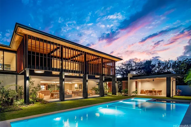 a backyard of a house with table and chairs