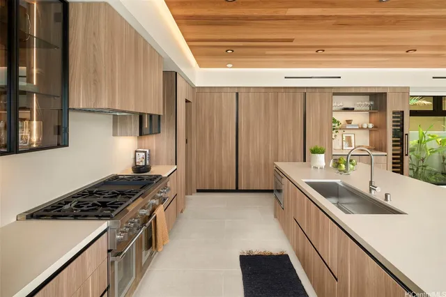 a kitchen that has a sink and a stove