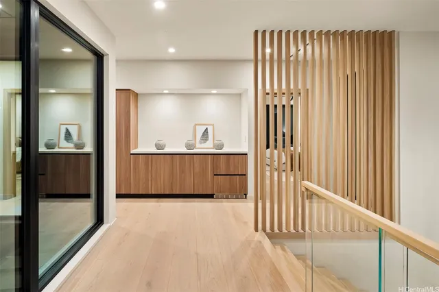 a view of a hallway with a kitchen