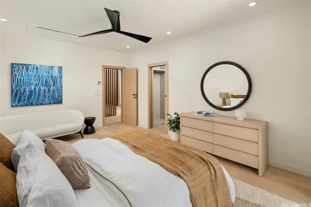 a bedroom with bed and a window