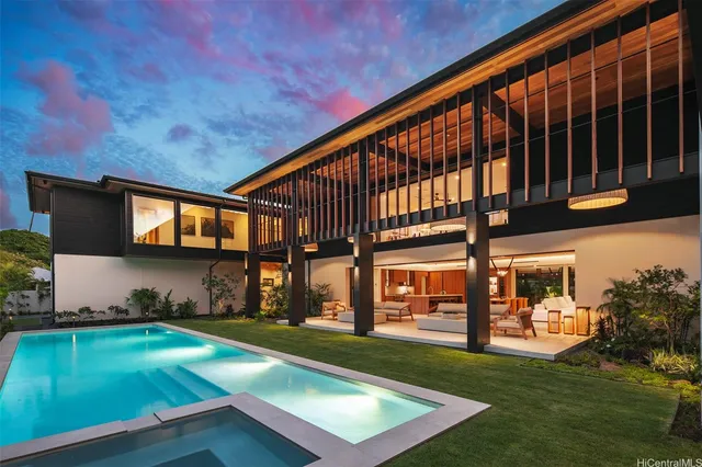 a view of a backyard with plants and a patio