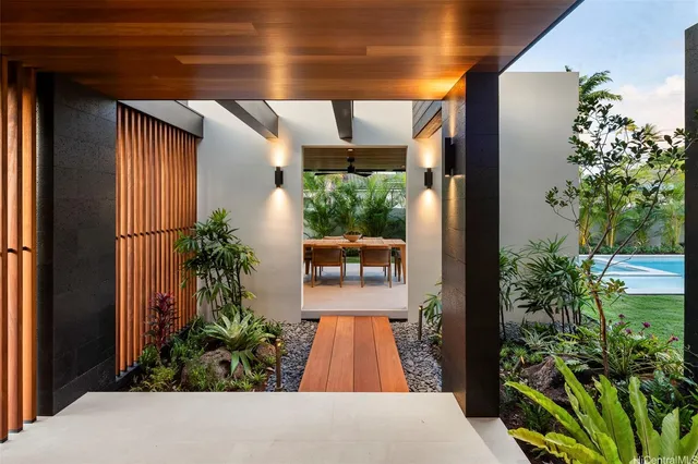a view of entryway with flower pots