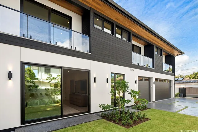 a front view of a house with garden