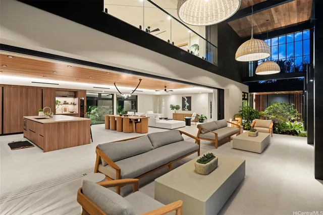 a living room with furniture a rug and a large window