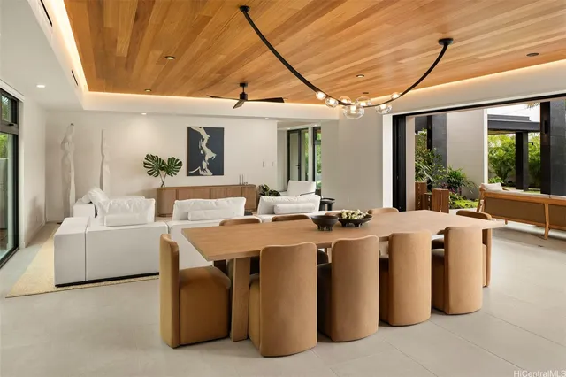 a view of a living room and kitchen with furniture