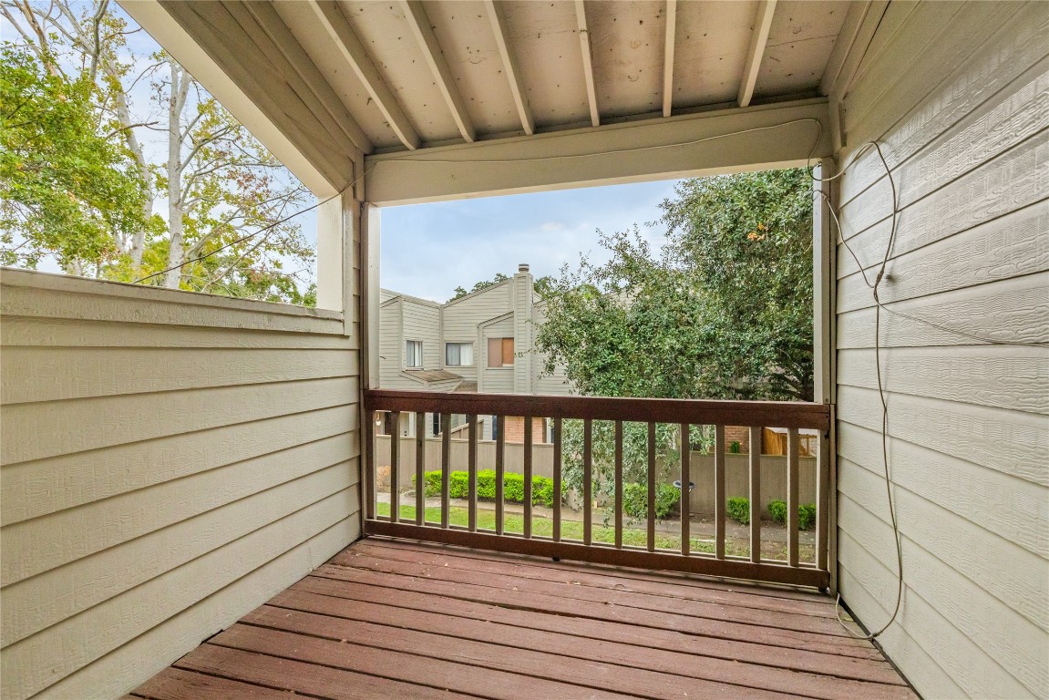 1621 Prairie Mark Lane Houston, TX 77077 - Photo 11 of 26 a view of a balcony with wooden floor