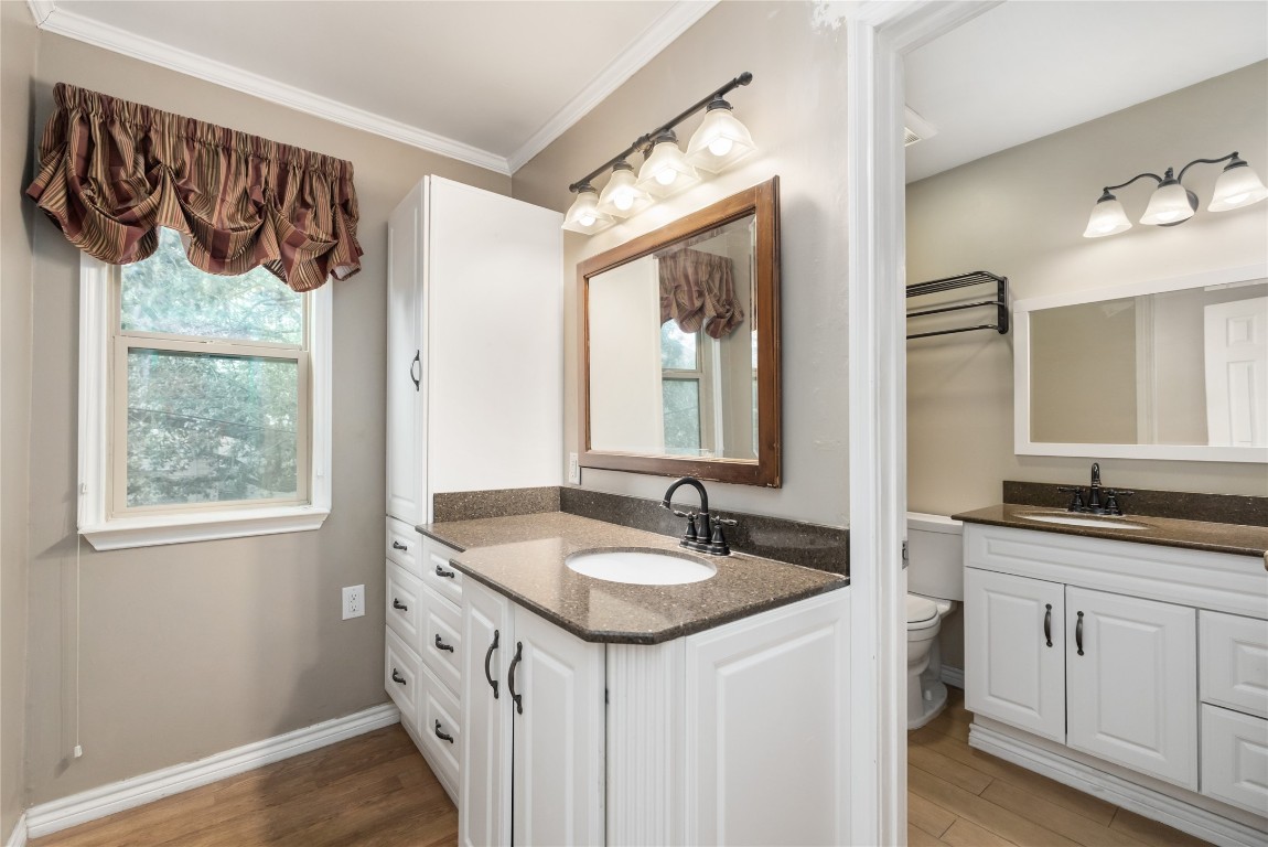 1621 Prairie Mark Lane Houston, TX 77077 - Photo 12 of 26 a bathroom with a granite countertop sink and a mirror