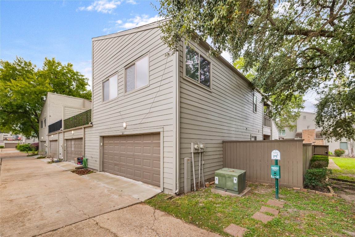 1621 Prairie Mark Lane Houston, TX 77077 - Photo 16 of 26 a front view of a house with a yard