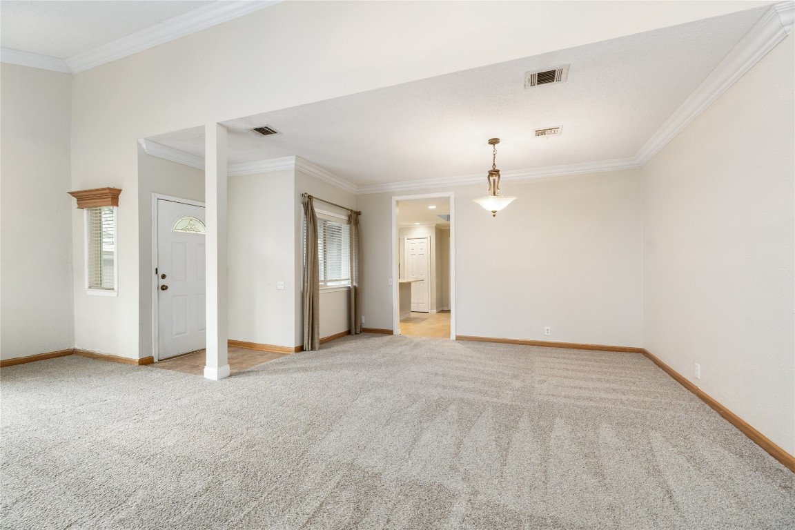 1621 Prairie Mark Lane Houston, TX 77077 - Photo 20 of 26 an empty room with closet and a chandelier fan