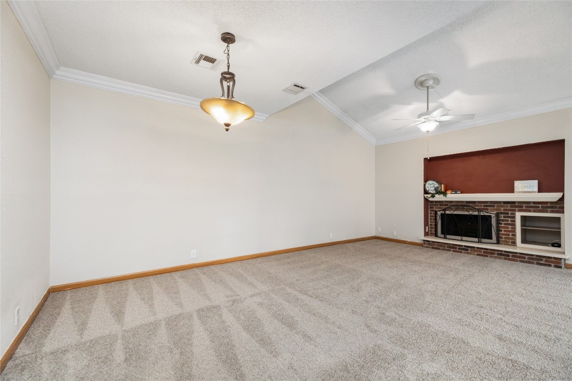 1621 Prairie Mark Lane Houston, TX 77077 - Photo 22 of 26 a view of an empty room with a fireplace and a window