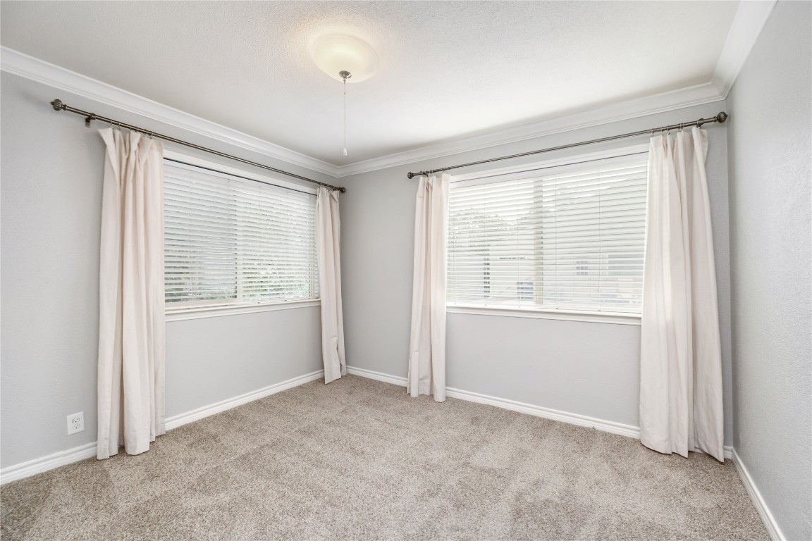 1621 Prairie Mark Lane Houston, TX 77077 - Photo 24 of 26 a view of an empty room with a window