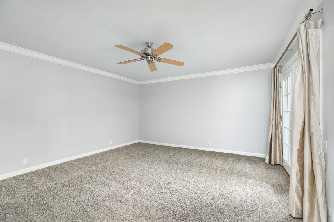 1621 Prairie Mark Lane Houston, TX 77077 - Photo 26 of 26 an empty room with a empty space and a ceiling fan