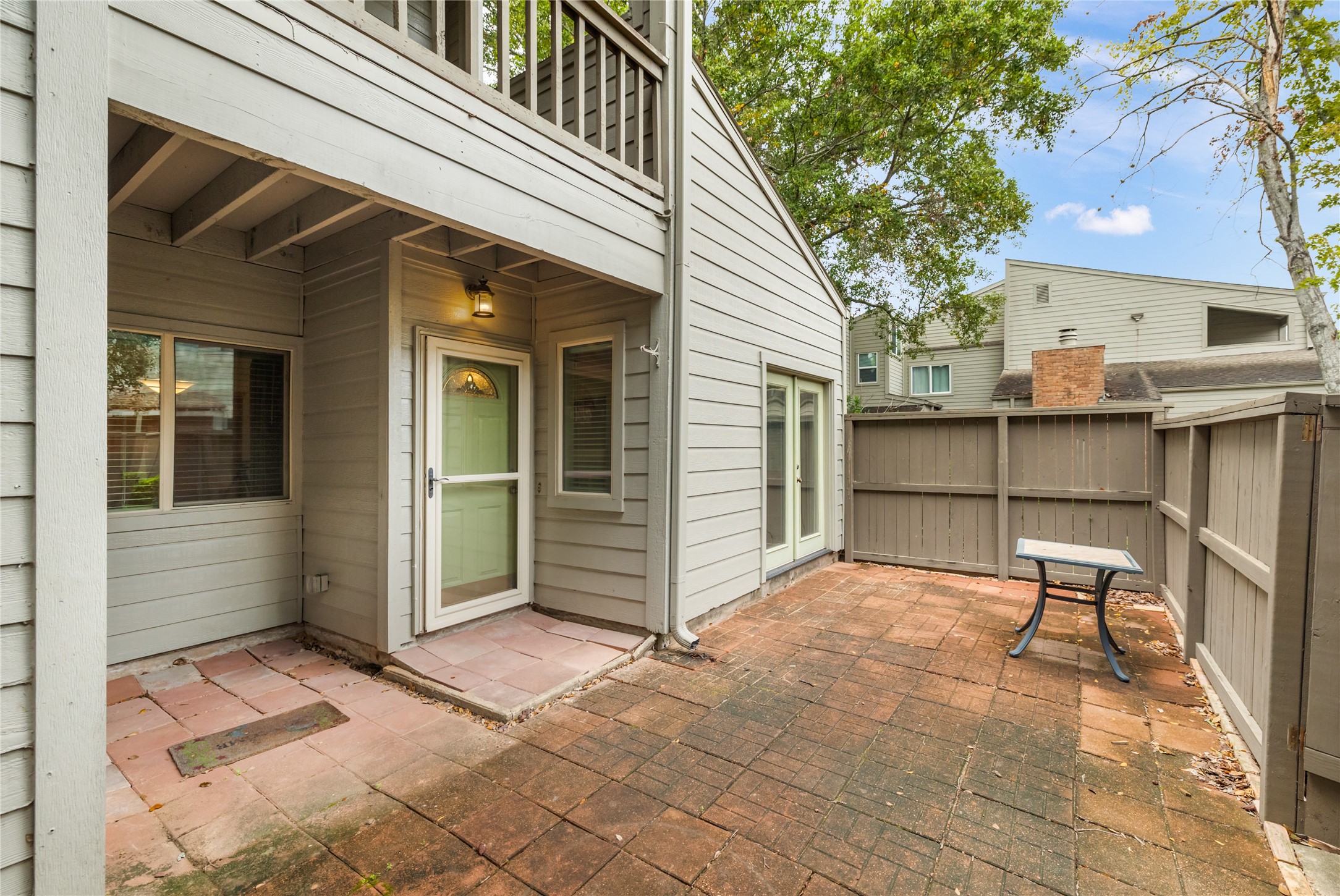 1621 Prairie Mark Lane Houston, TX 77077 - Photo 6 of 26 a view of a house with a patio and a yard