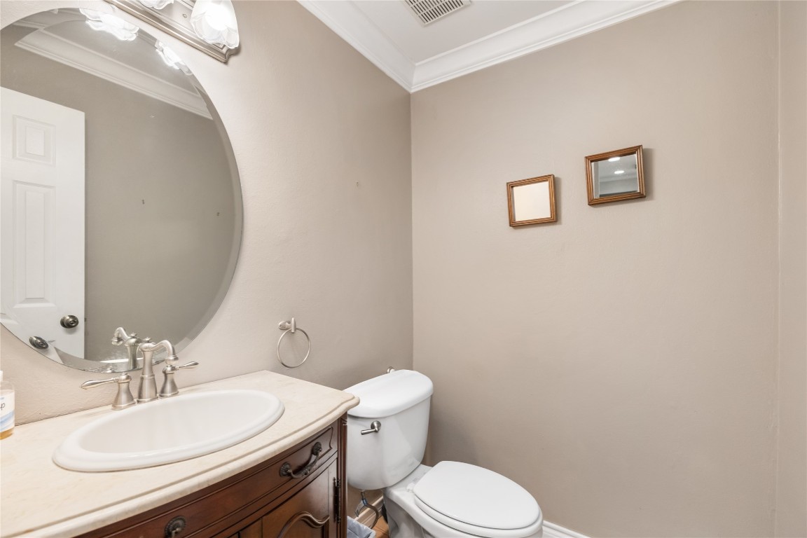 1621 Prairie Mark Lane Houston, TX 77077 - Photo 10 of 26 a white toilet sitting next to a bathroom sink