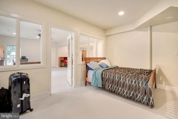a bed room with a bed and dresser