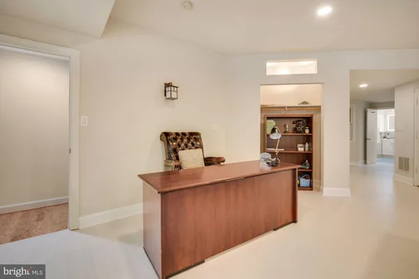 a view of kitchen with furniture and wooden floor