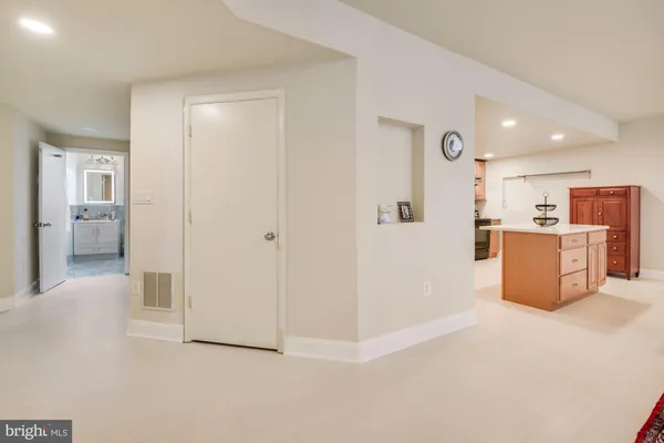 a view of kitchen and refrigerator