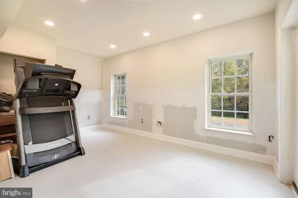 a view of room with window and air conditioner