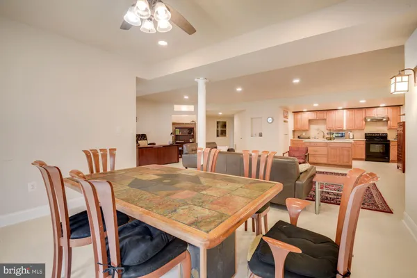 a view of a dining room with furniture and a chandelier