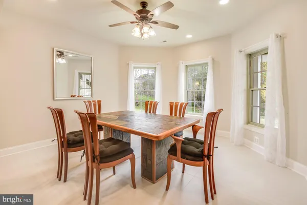 a view of a dining room with furniture and window