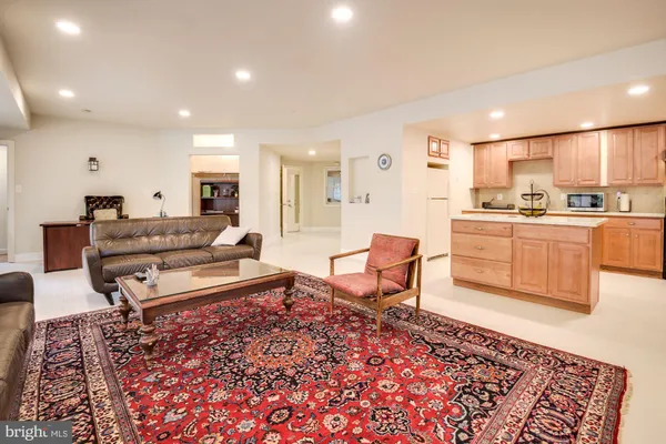 a living room with furniture and a rug