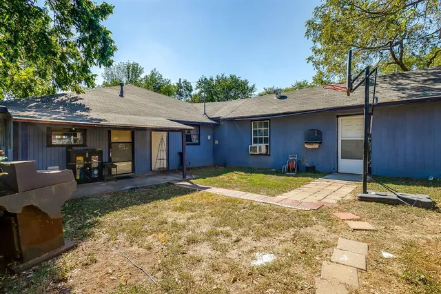 a house with trees in the background