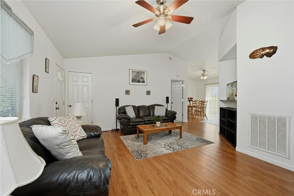18685 Oak Grove Road Hidden Valley Lake, CA 95467 - Photo 5 of 52 a living room with furniture and a fireplace