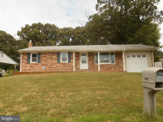 1406 Larch Road Severn, MD 21144 - Photo 1 of 15 a front view of a house with yard