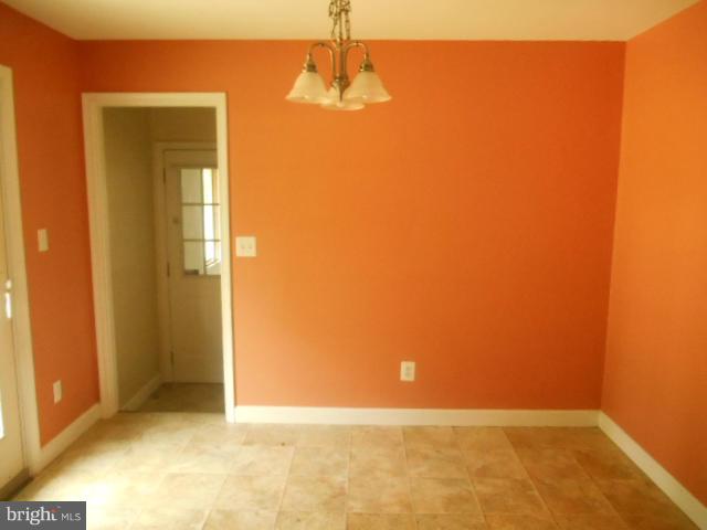 1406 Larch Road Severn, MD 21144 - Photo 3 of 15 an empty room with windows