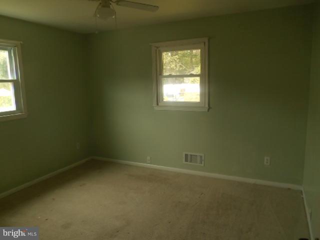 1406 Larch Road Severn, MD 21144 - Photo 5 of 15 an empty room with a window