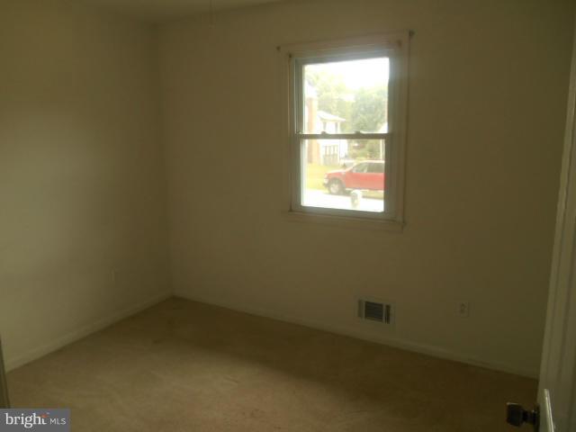 1406 Larch Road Severn, MD 21144 - Photo 7 of 15 an empty room with a window