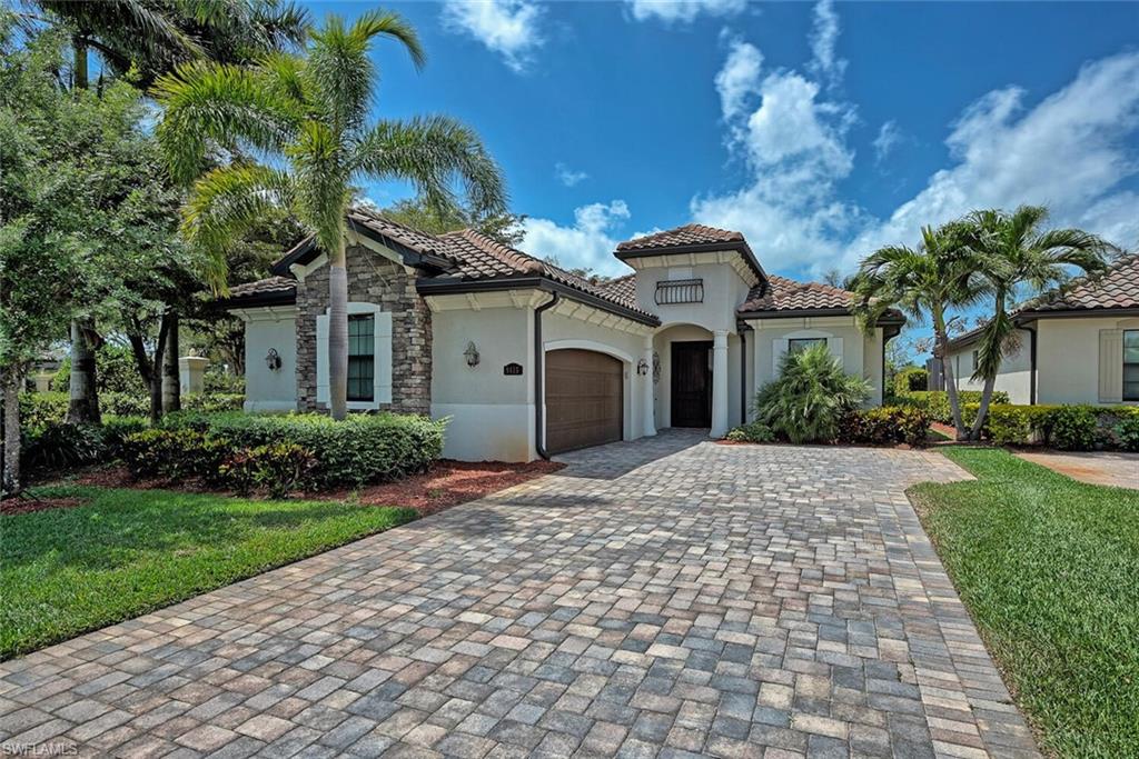 9415 Piacere Way Naples, FL 34113 - Photo 2 of 35 a front view of a house with garden