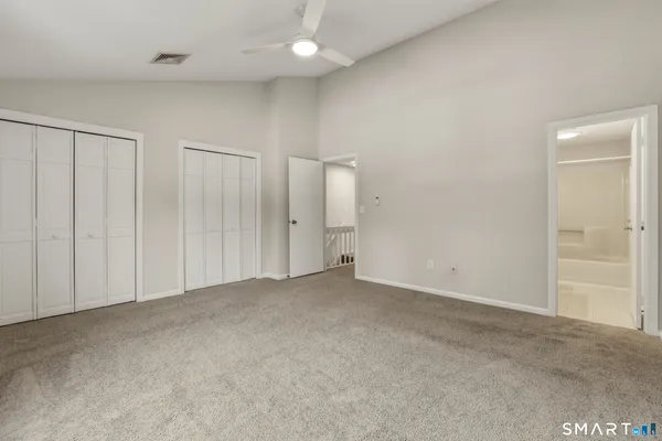 an empty room with closet area