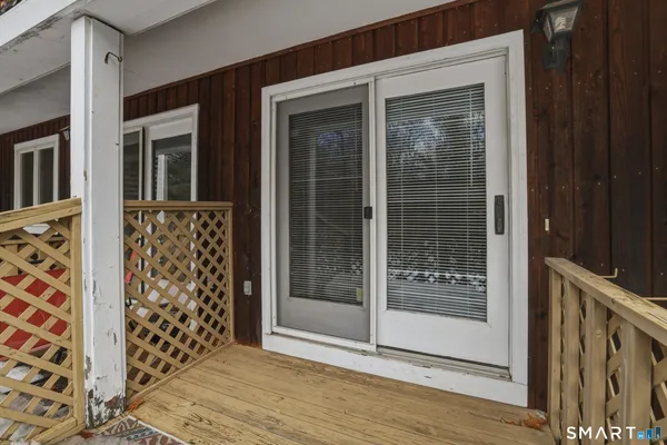 a view of front door and wooden floor