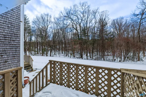 a view of a brick wall with iron fence