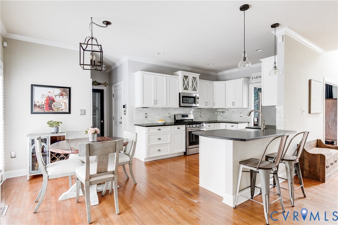 4907 Winding Branch Road Moseley, VA 23120 - Photo 15 of 53 Kitchen featuring white cabinetry, stainless steel