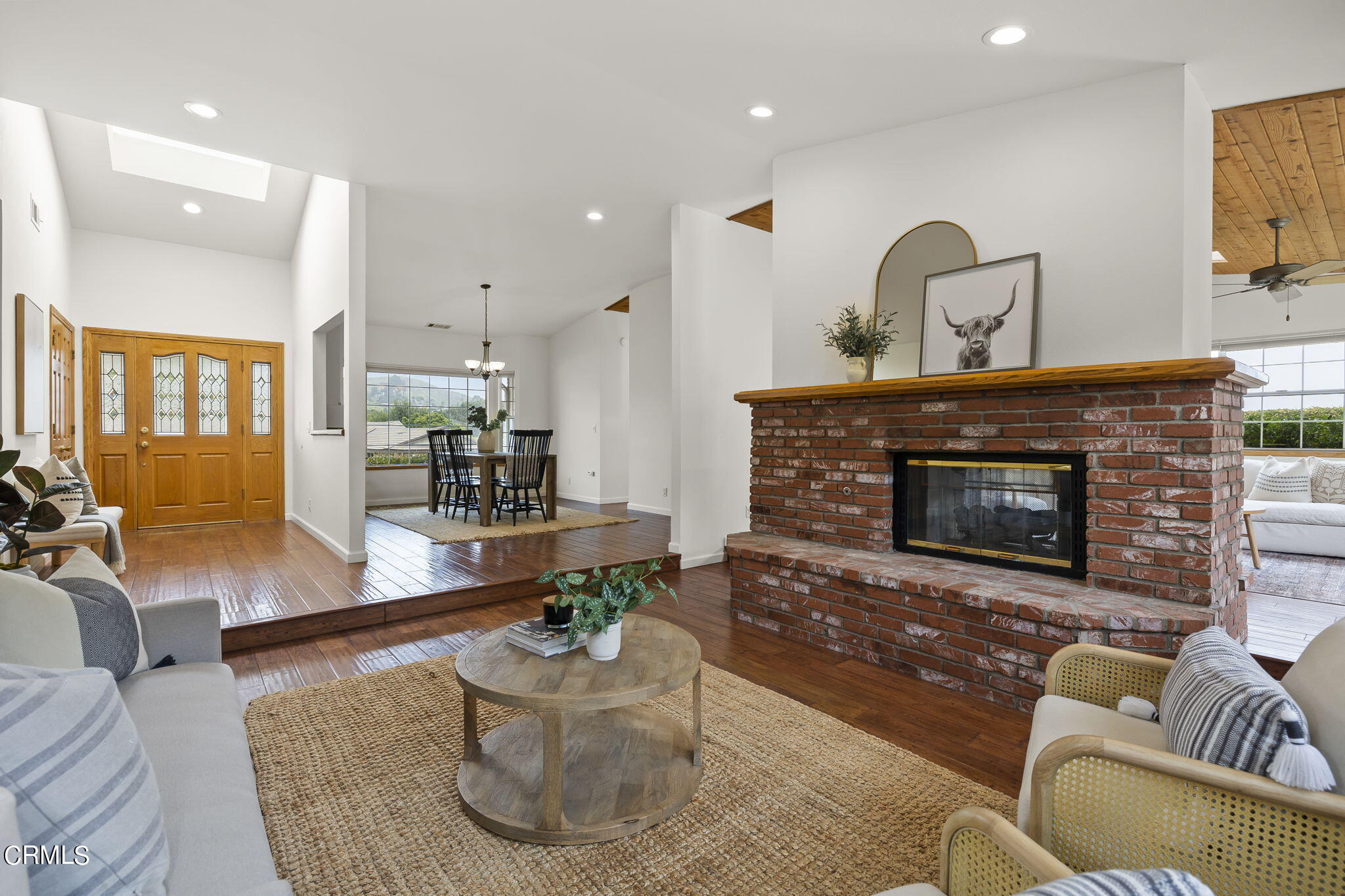 116 Via Pasito Ventura, CA 93003 - Photo 11 of 61 a living room with furniture and a fireplace